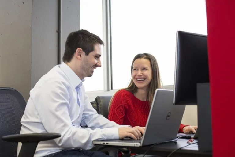 How Tracktik Works For Your Success 12 TrackTik employees working together in the office
